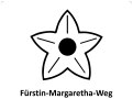 Symbol eines fünfzackigen Sterns mit Kreis in der Mitte, darunter steht 'Fürstin-Margaretha-Weg'.