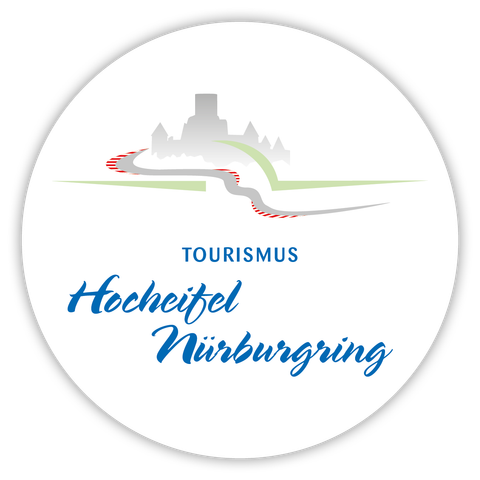 Kreisrundes Logo mit der Stilisierten Nürburg und dem Schriftzug Hocheifel-Nürburgring